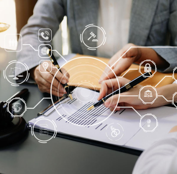 Young smiling businesswoman sits at working table on background Young smiling businesswoman sits at working table on background